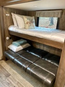 Bunk area with extra seating or sleeping space