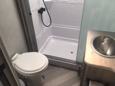 Shower, toilet, and sink